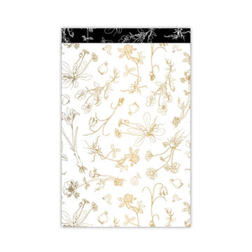 Cadeauzakje L met bloemenprint in goud en zwart op witte achtergrond – Liefs en Lintjes